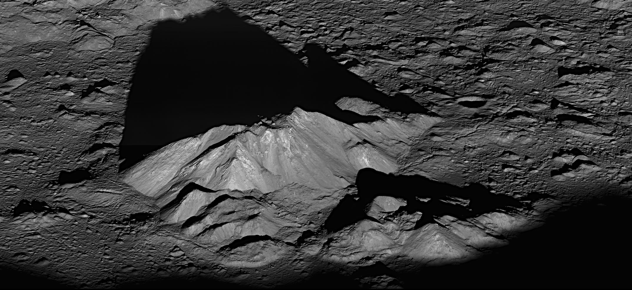 NAC oblique view of Tycho crater central peak in low-sun lighting and long shadows.