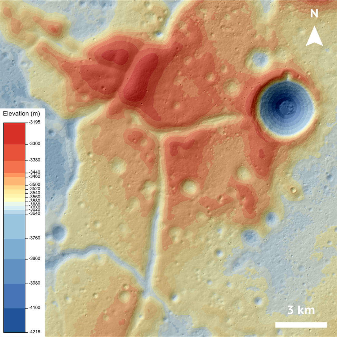 In this image, which is the same as the featured image at the beginning of the post, the WCK is centered in the middle surrounded by the Mare Crisium. There is a key in the bottom left corner that shows the elevations of the WCK ranging from -4,218 m (shaded a dark blue) to -3,195 m (shaded red). The fractures cutting across the kipuka are yellow or light blue, indicating that they are lower in elevation. North is towards the top of the page.